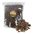 Dog Treatz smoked bone treats for dogs, 2.5 kg, in a bag of snacks and biscuits, showing the smoked bone treats in a natural setting.