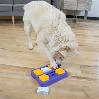 Nina Ottosson Dog Brick puzzle toy for dogs, measuring 22x17x5 cm, made of durable plastic for interactive play.