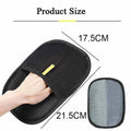 Black Pawciara pet grooming glove with deshedding bristles for dogs and cats, used for massage and hair removal.