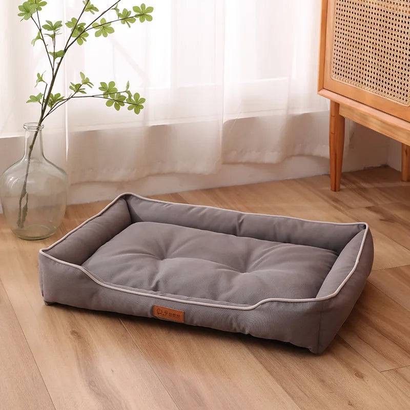 Large Pawciara plush pet sofa bed in orange and gray, cozy sleeping area for dogs and cats, winter-warm and spacious.