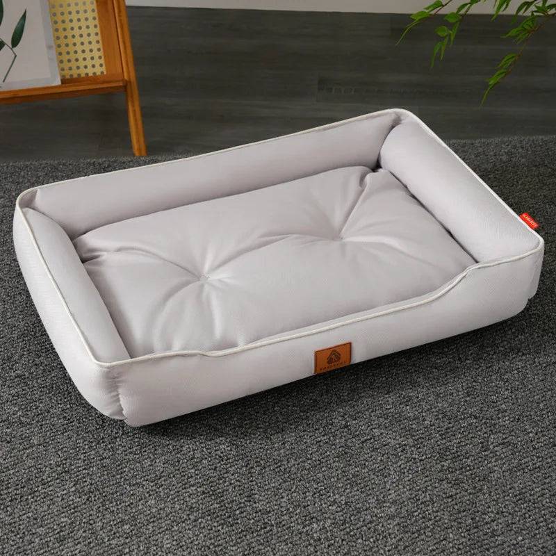 Large Pawciara plush pet sofa bed in orange and gray, cozy and warm for dogs and cats, ideal for winter comfort.