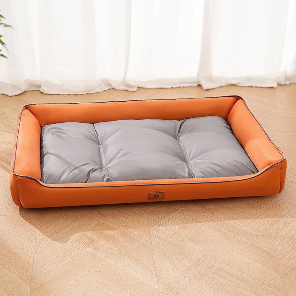 Large Plush Pawciara Pet Sofa Bed in orange and gray, cozy and warm for dogs and cats, with spacious sleeping area and soft cushion.