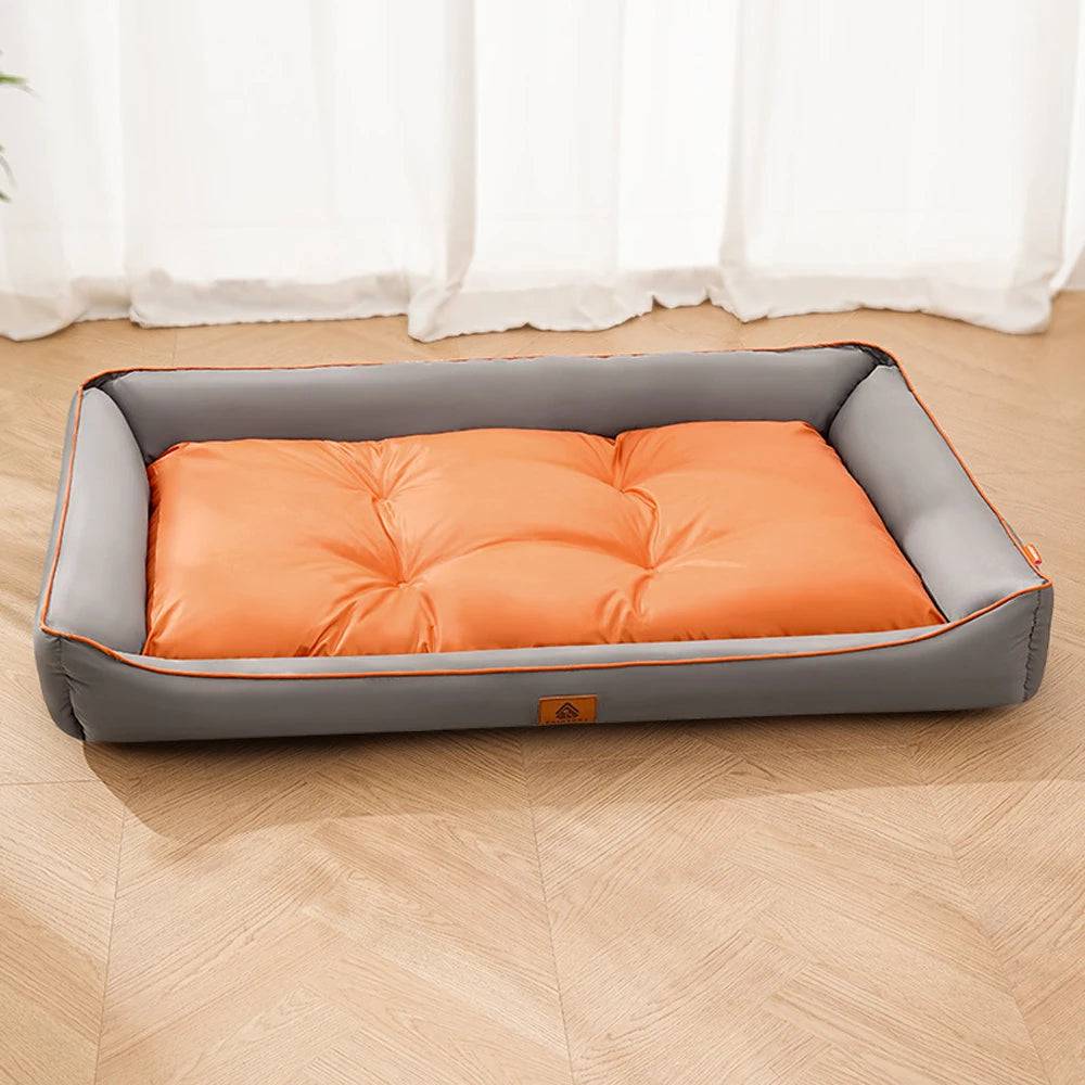 Large plush Pawciara pet sofa bed in orange and gray, cozy and spacious for dogs and cats to sleep comfortably indoors.