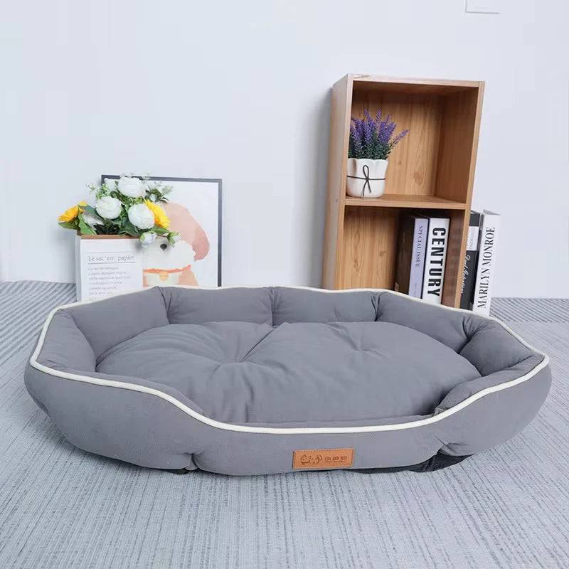 Orange and gray large plush pet sofa bed by Pawciara, cozy and warm dog and cat sleeping bed with spacious design.