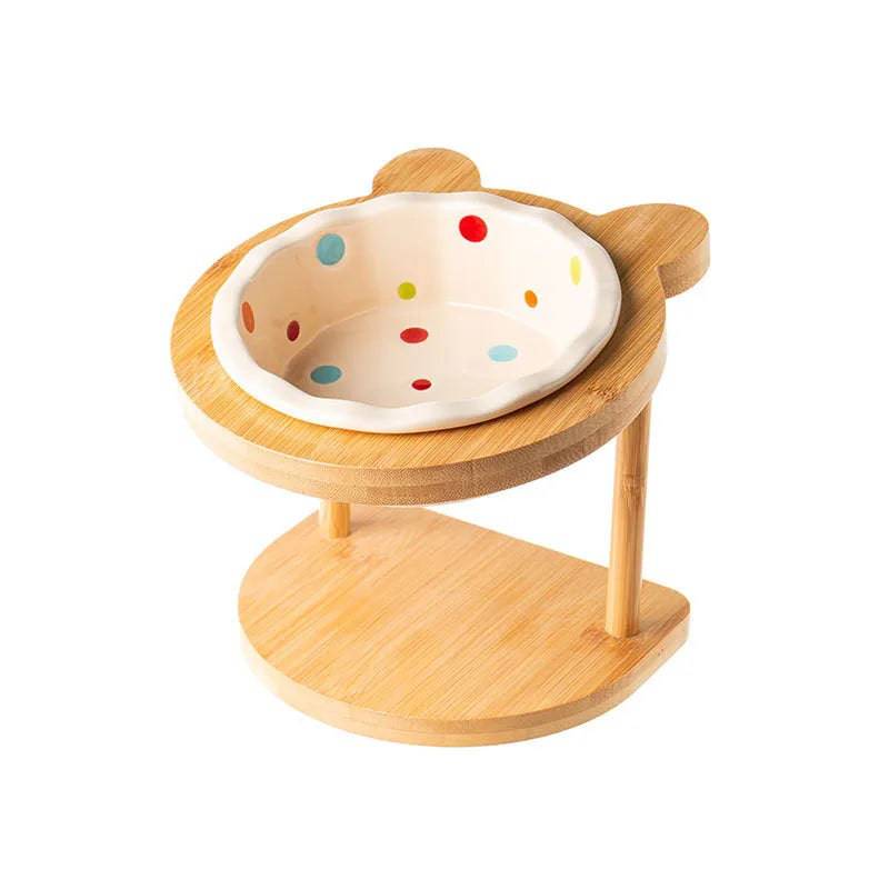 White raised ceramic double bowl stand for dogs and cats, featuring food and water bowls on a wooden table pet feeder.
