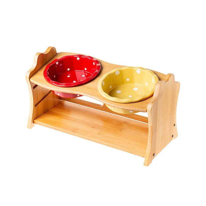 Raised ceramic double bowl stand for dogs and cats by Pawciara, featuring white bowls on a wooden stand for food and water.