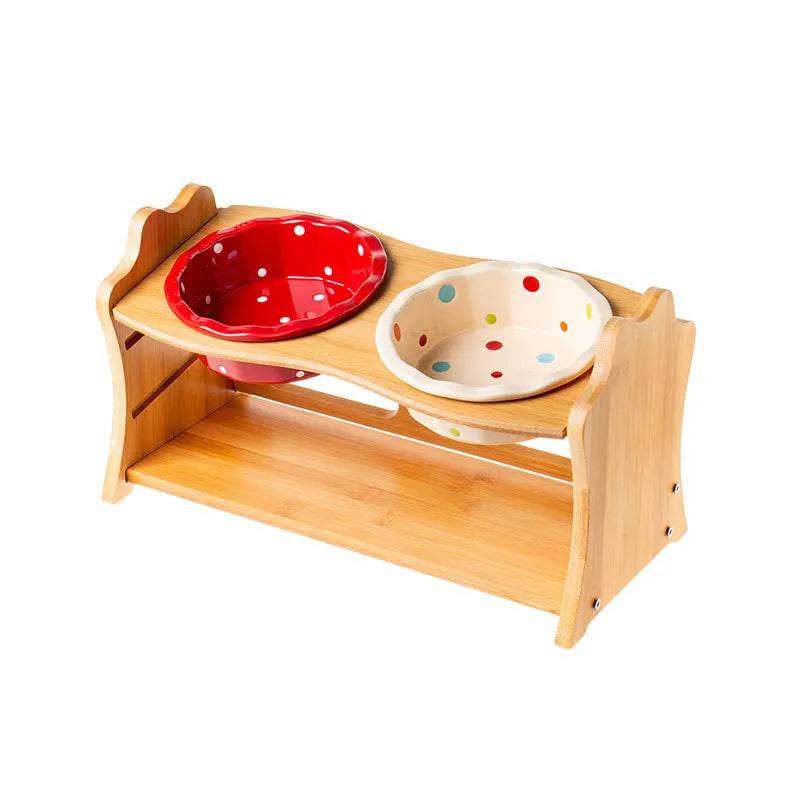 Raised ceramic double bowl stand for dogs and cats by Pawciara, white food and water bowls on a wooden stand for pets.