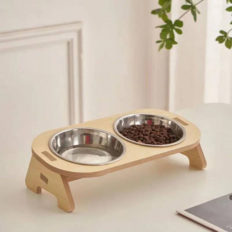 Pawciara double pet food and water bowl stand with anti-tip design, featuring two stainless steel bowls for cats and dogs.