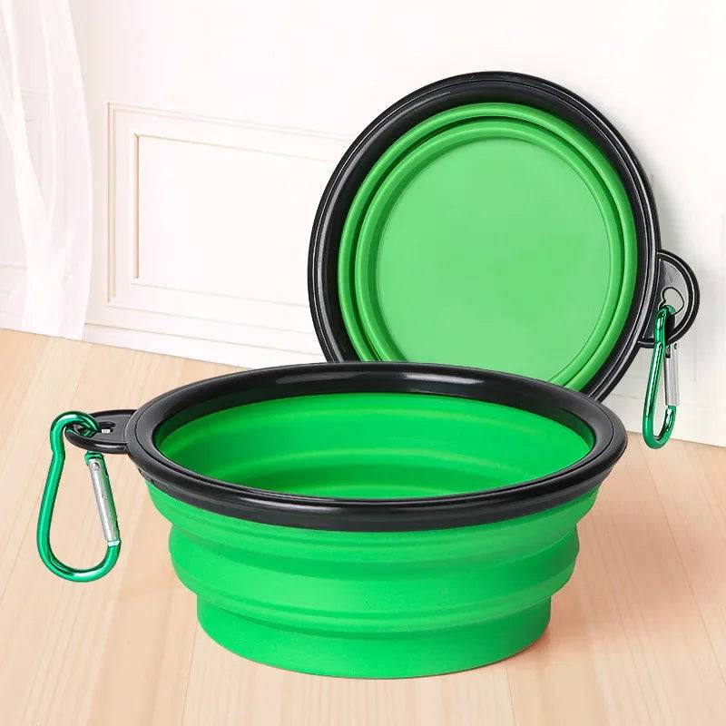 White Pawciara collapsible silicone pet bowl for dogs, portable outdoor travel food and water dish with carabiner for camping and walks.