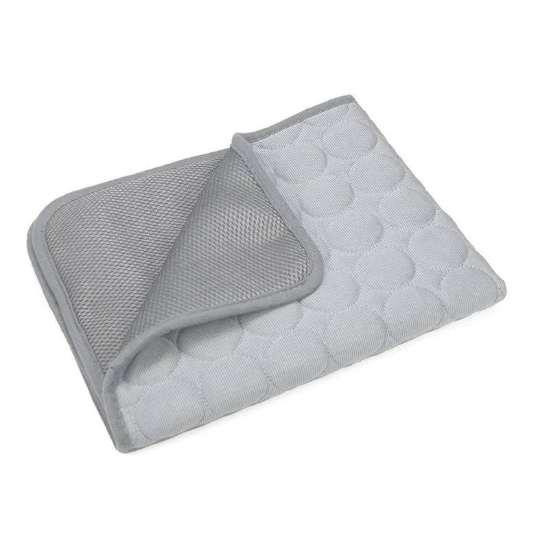 Pawciara waterproof self-cooling pet bed mat for dogs and cats, gray summer ice silk cooling pad with anti-slip and washable features.