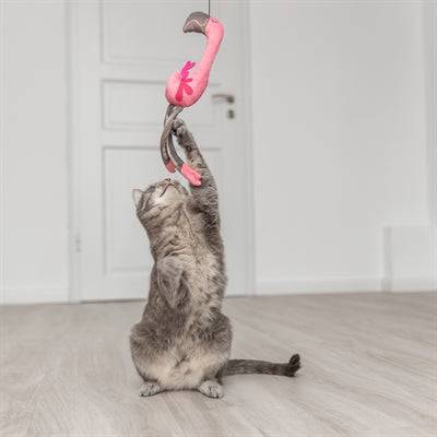 Trixie telescopic cat teaser wand with flamingo pink feathers, extending up to 106 cm, designed for interactive play with cats.