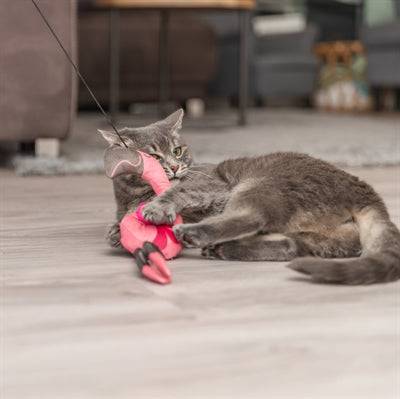 Trixie telescopic cat teaser wand with flamingo pink color, extended to 106 cm, featuring a playful feather attachment for cats.