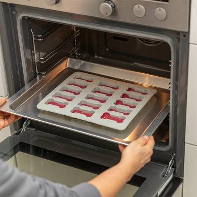 Trixie silicone baking mat for pet treats in bone shape, grey, 24 x 29 cm, non-stick, BPA-free, suitable for baking pet treats.