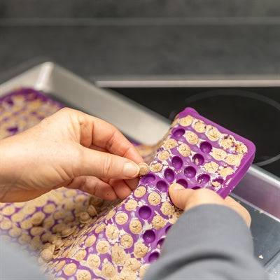 Trixie silicone baking mat for pet treats in purple, 38x28 cm, non-stick surface for easy baking and treats.
